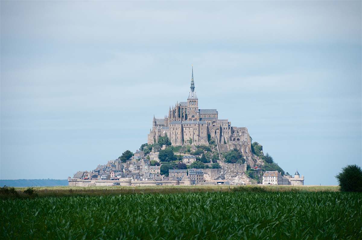 architecture grass field and castle spire