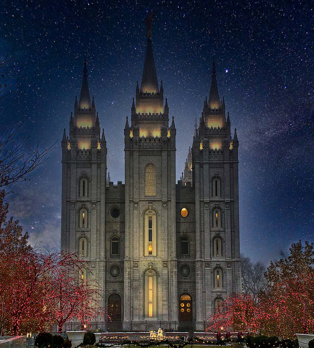 spire gray castle beside trees steeple