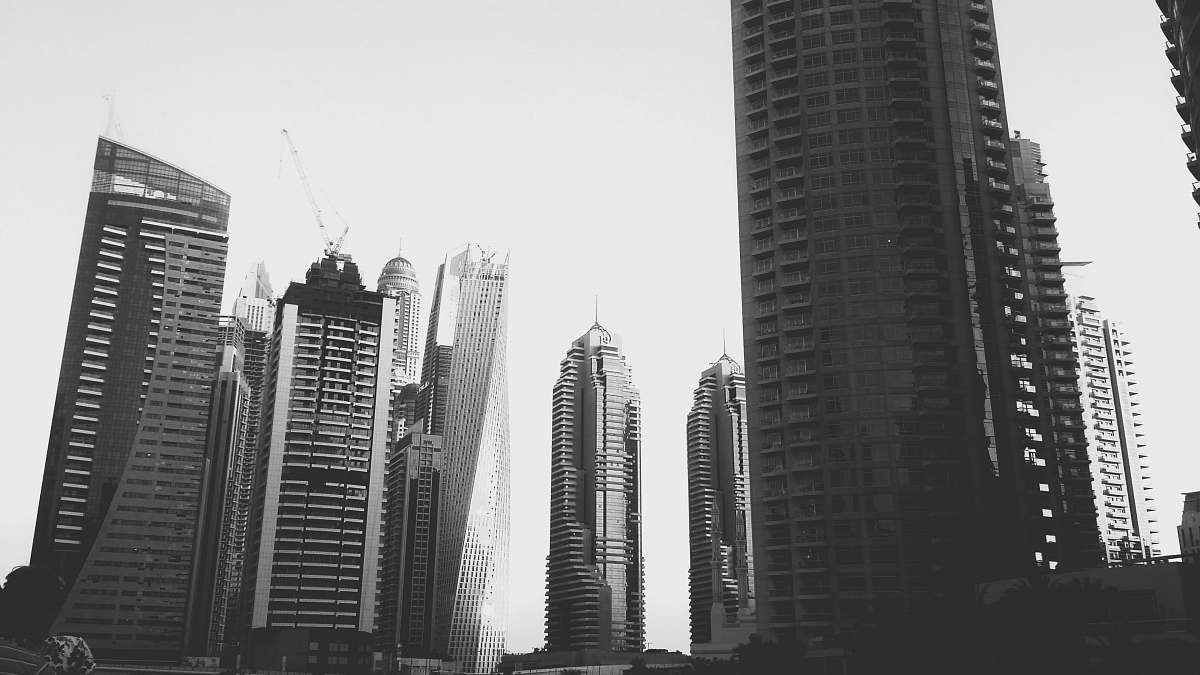 city high raise building in grayscale photography black-and-white