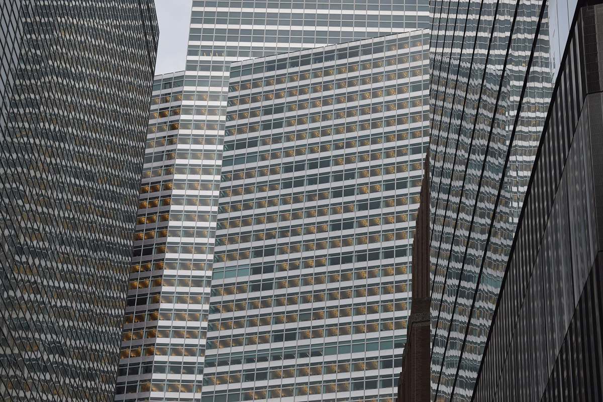 architecture low angle photography of grey high-rise buildings black-and-white
