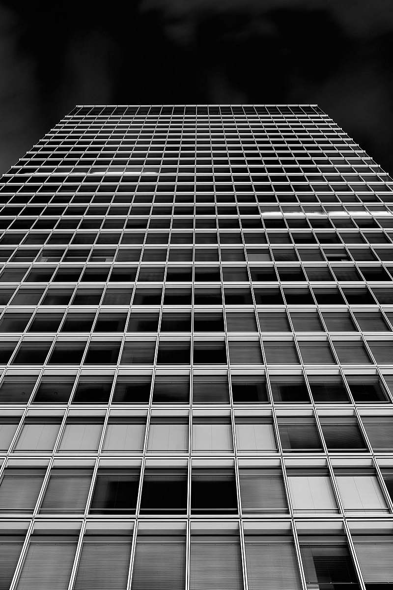 architecture low angle photography of high-rise building black-and-white
