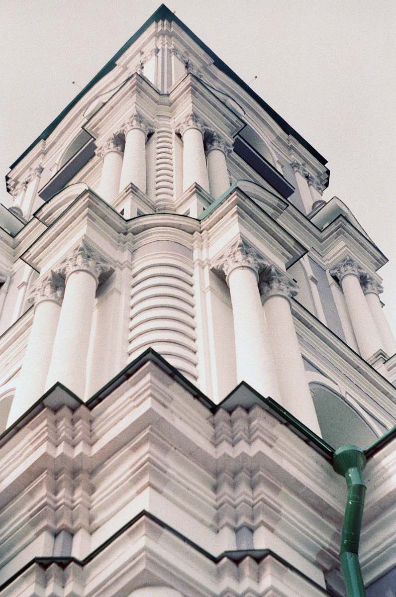 architecture low angle photography of white concrete building tower