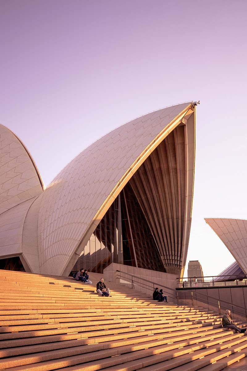architecture people sitting on bench on Sydney Opera House during daytime human