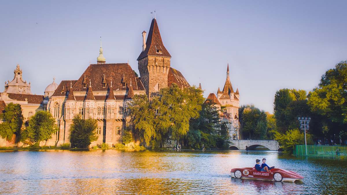 architecture red boat on body of water during daytime castle