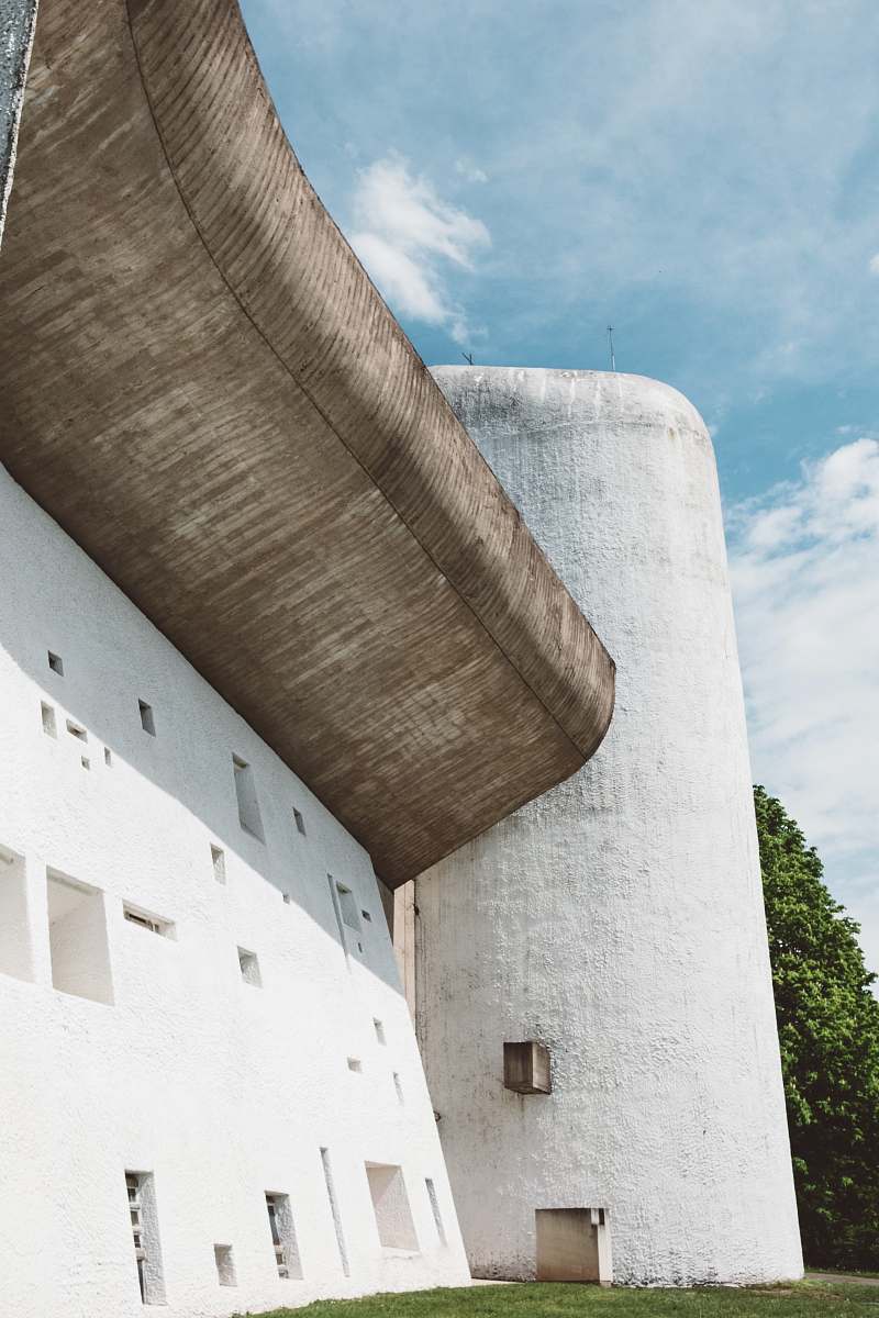 architecture white and brown concrete building during daytime tower