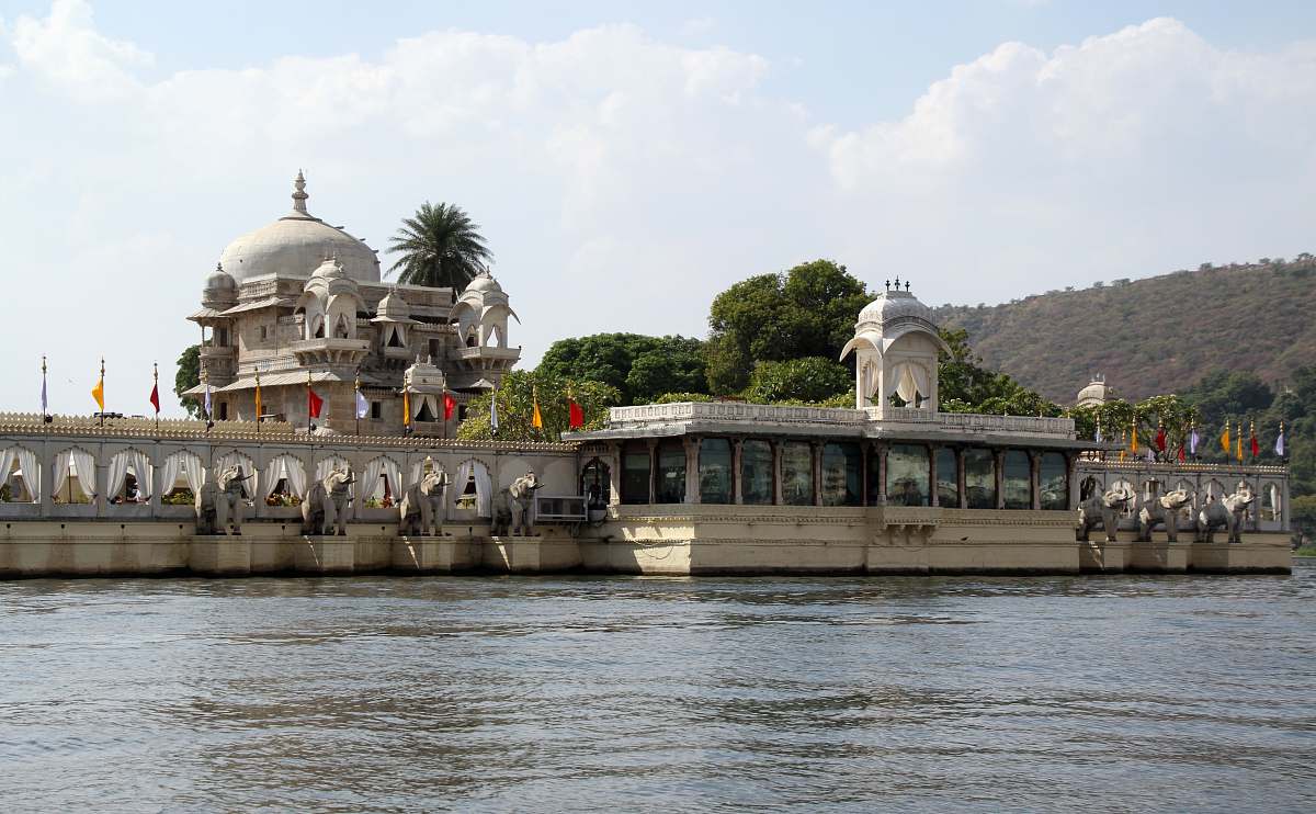 architecture white concrete building near body of water dome