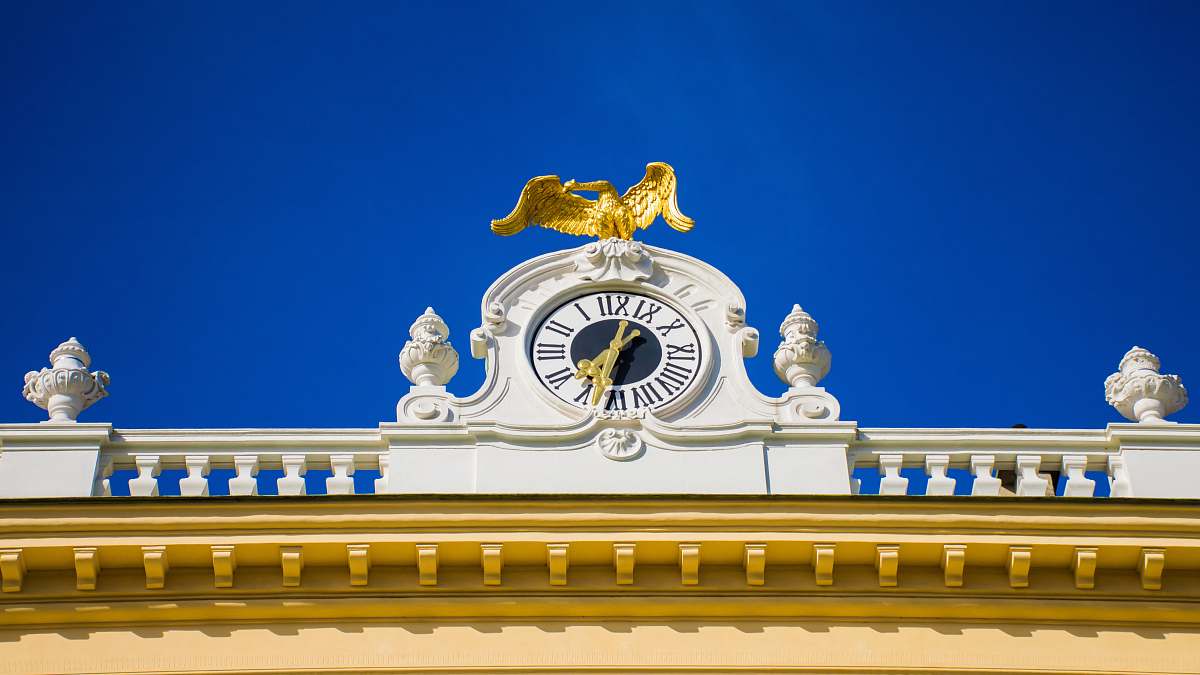 architecture white framed analog clock during daytime tower