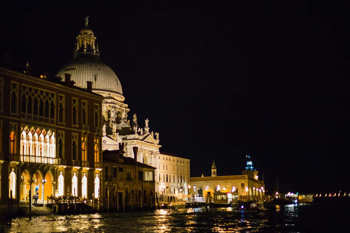 architecture white historic building near body of water during night time dome