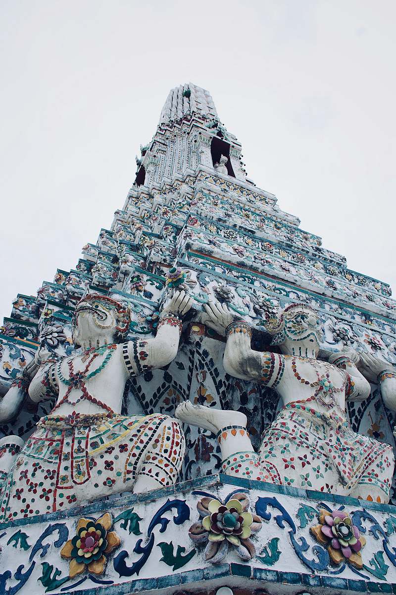 Explore the breathtaking architecture of this stunning white temple, where intricate designs and serene surroundings create a tranquil atmosphere. Ideal for travel blogs, architectural showcases, or spiritual retreats, this image captures the essence of peace and beauty. Perfect for use in promotional materials, websites, or educational resources highlighting cultural heritage and stunning structures.