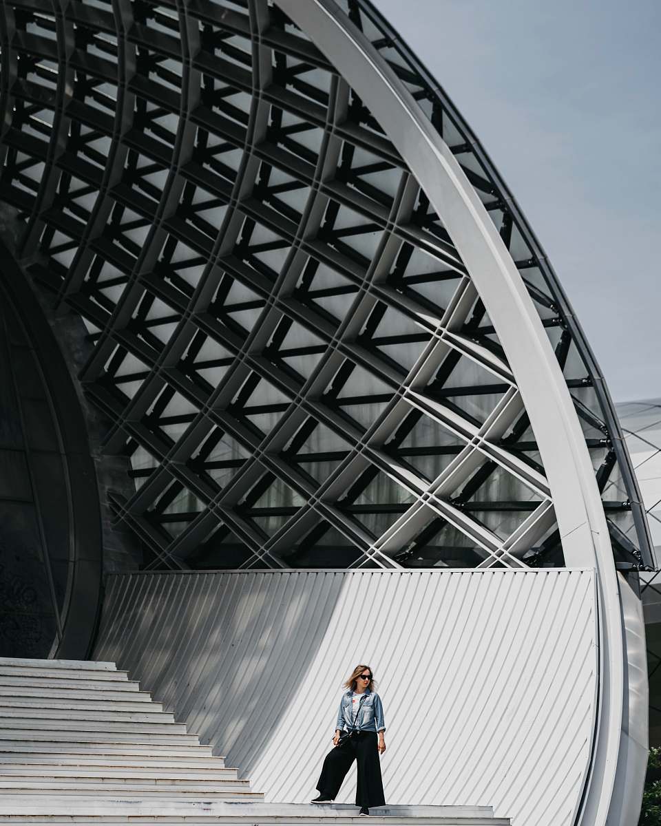 architecture woman standing on stairs planetarium