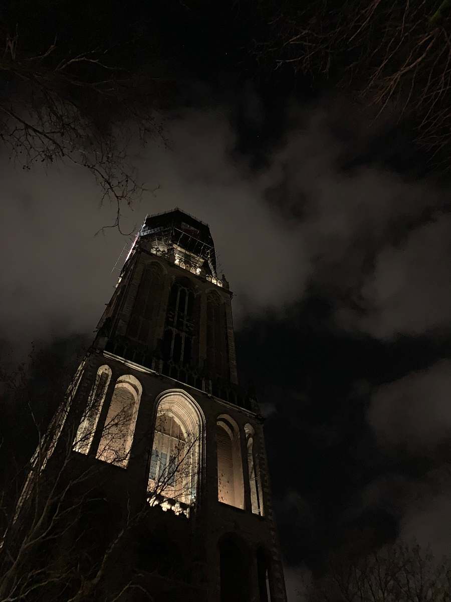 architecture worm view photo of building during nighttime tower