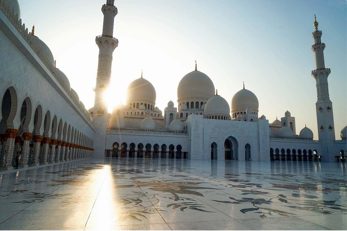 architecture low-angle photography of white mosque during golden hour building