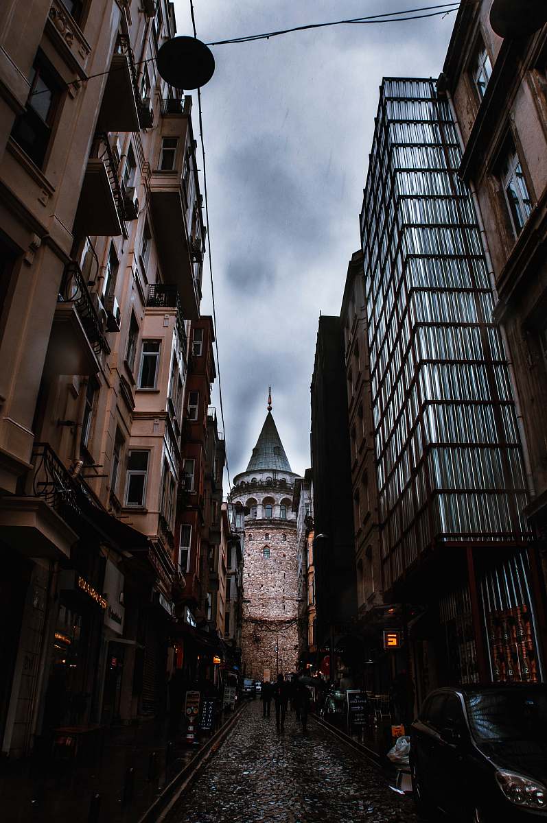 tower alley during daytime steeple