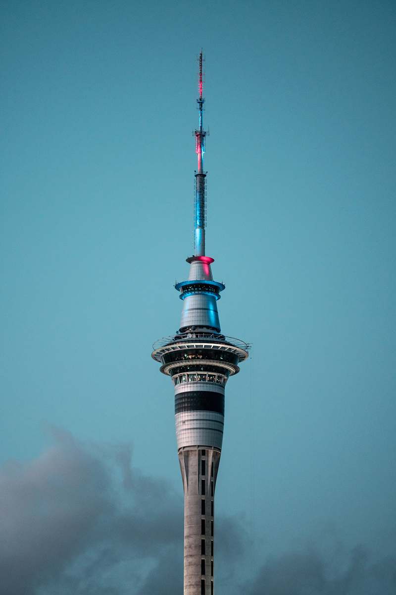 steeple concrete tower during daytime spire