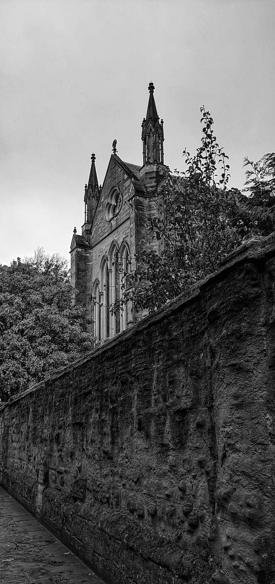 spire grayscale photography of a cathedral building black-and-white