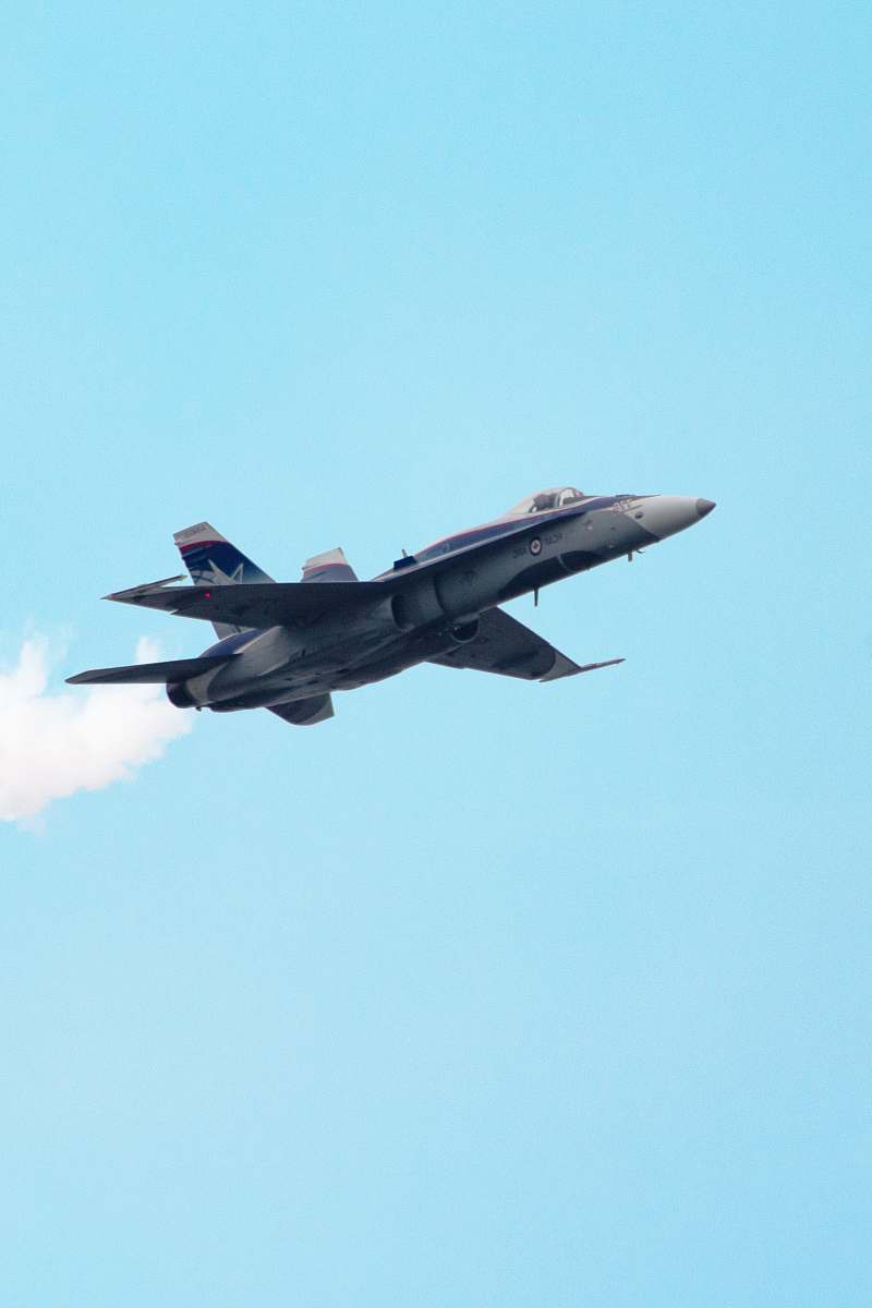 airplane selective focus photography of gray fighter plane on air during daytime bomber