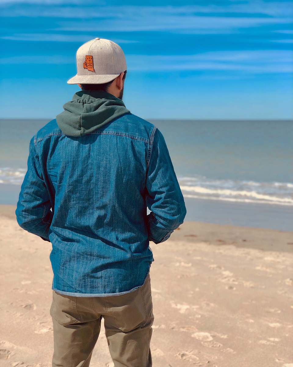 clothing man standing on shore during daytime nature