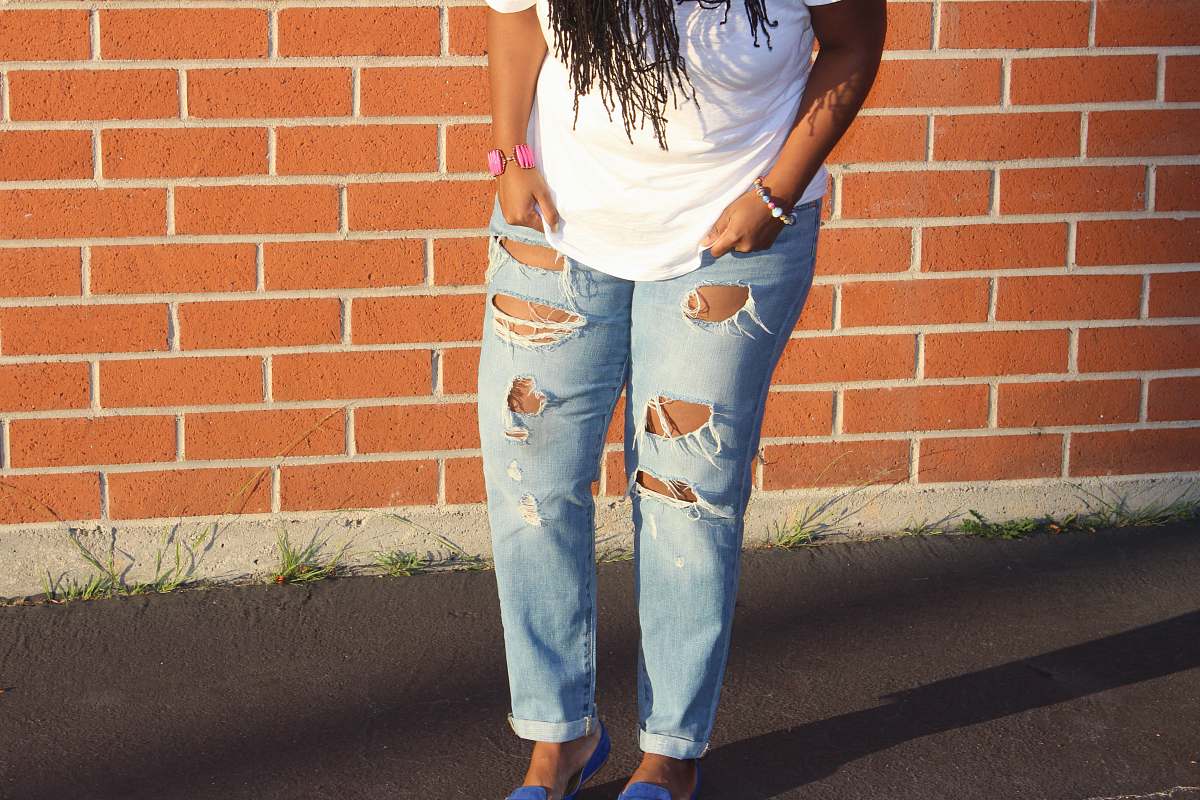 clothing person in blue denim distressed pants pants