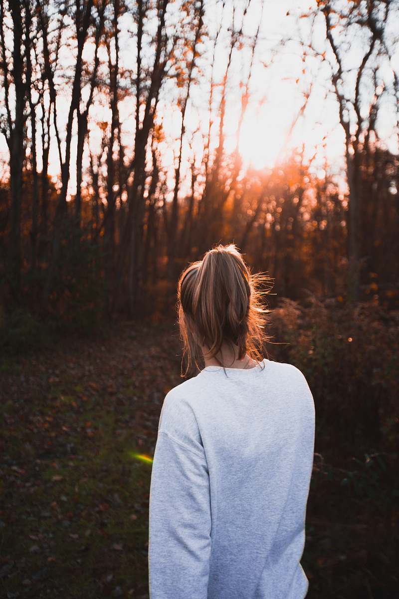 clothing woman facing brown woods sleeve