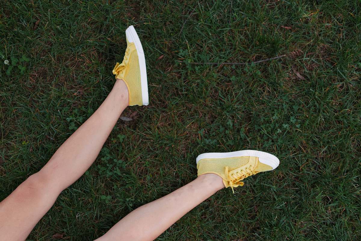 clothing yellow-and-white low-top sneakers footwear