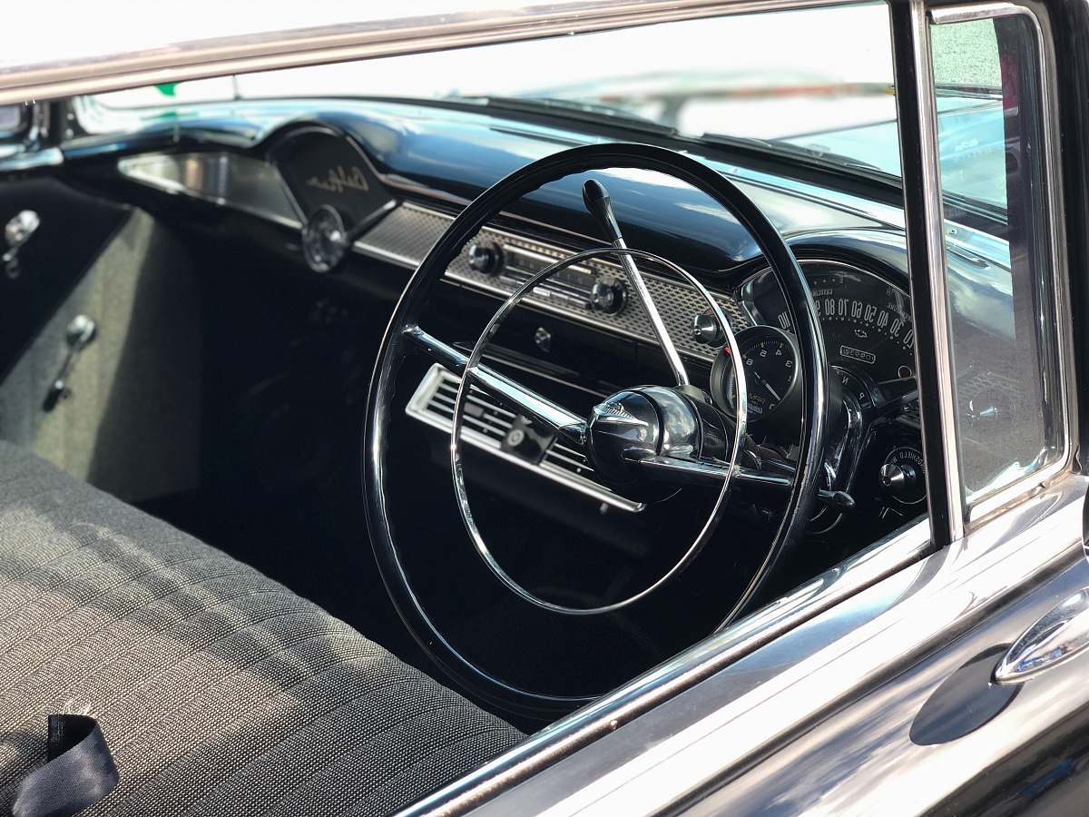 car black steering wheel in close up photography transportation