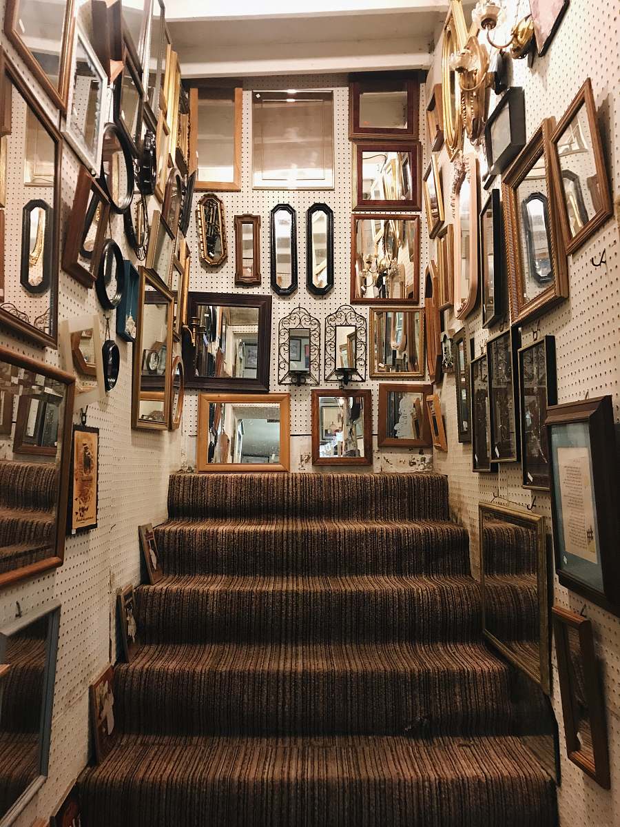 handrail assorted photo frames lot on wall staircase