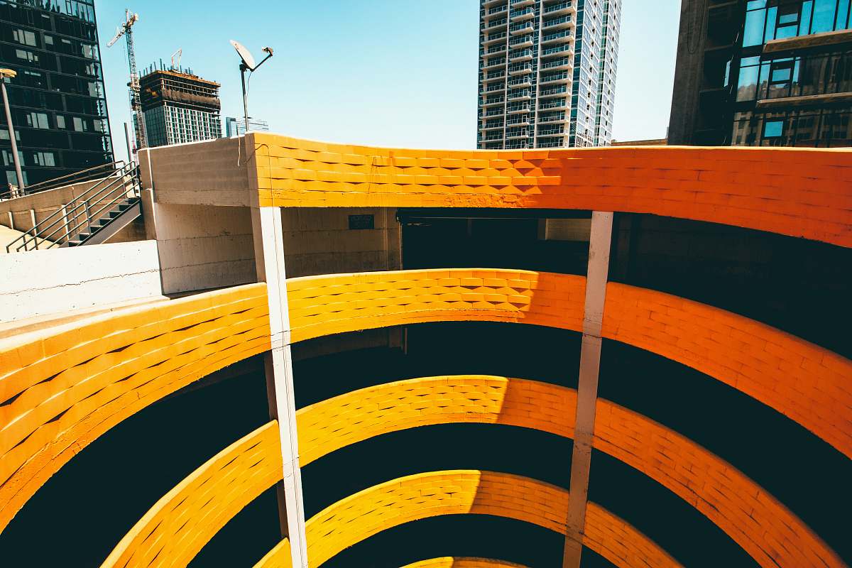 handrail top-view photography of spiral building rainbow garage