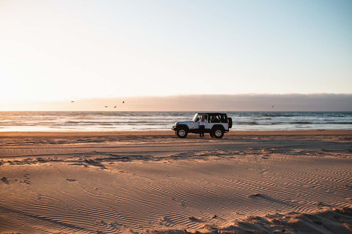 coast white wrangler beside the beach ocean