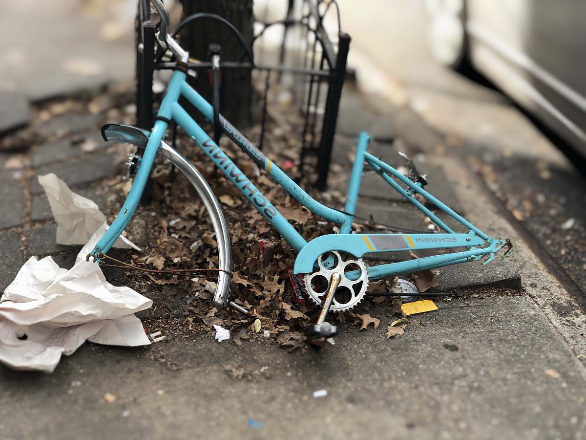 brooklyn blue Schwinn bicycle frame leaning on black metal frame united states
