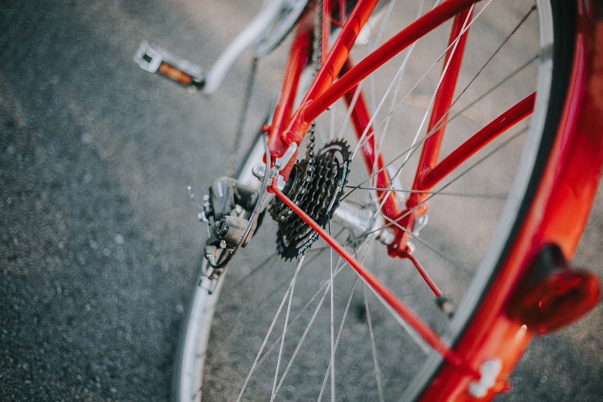 bicycle selective focus photography of red and gray bicycle transportation
