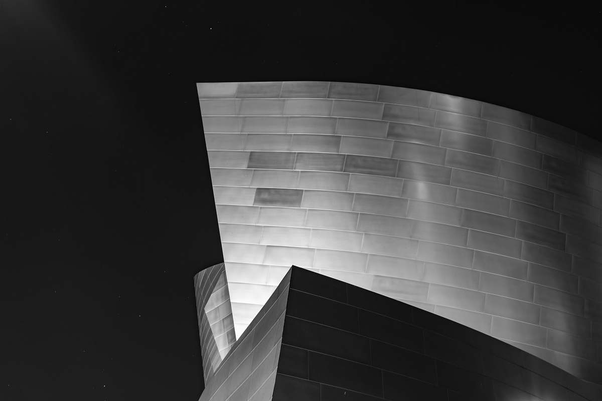 grey grayscale photo of concrete building walt disney concert hall