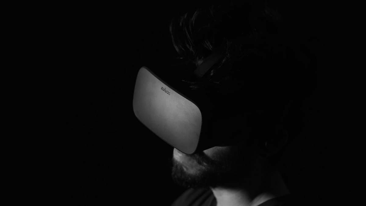 grey grayscale photo of man using virtual reality headset miami