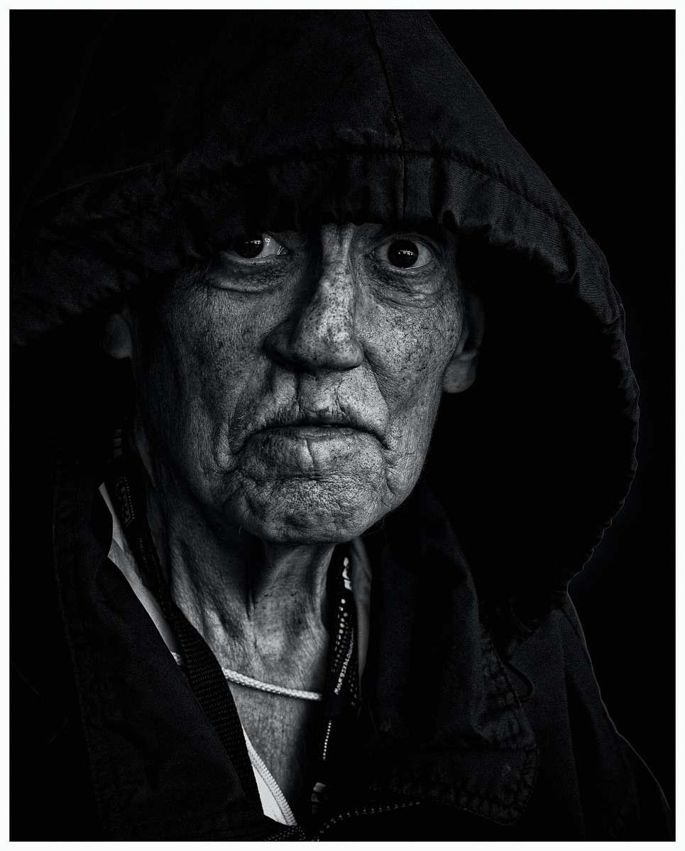portrait grayscale photo of man wearing black jacket face