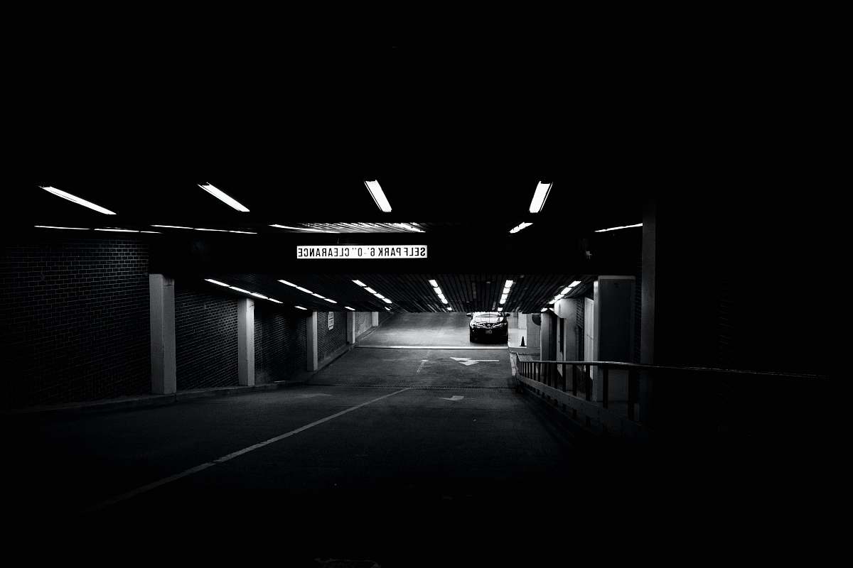parking grayscale photo of parking area parking lot