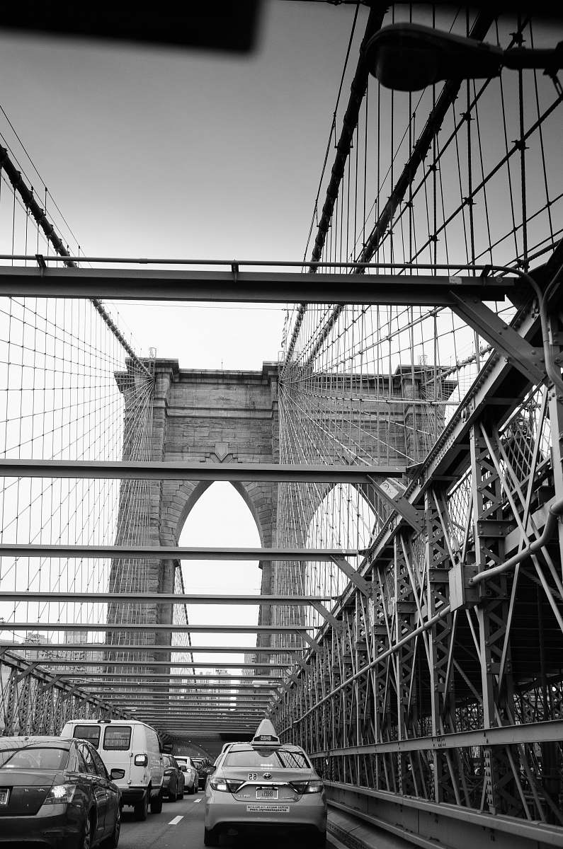 bridge grayscale photography of concrete bridge car