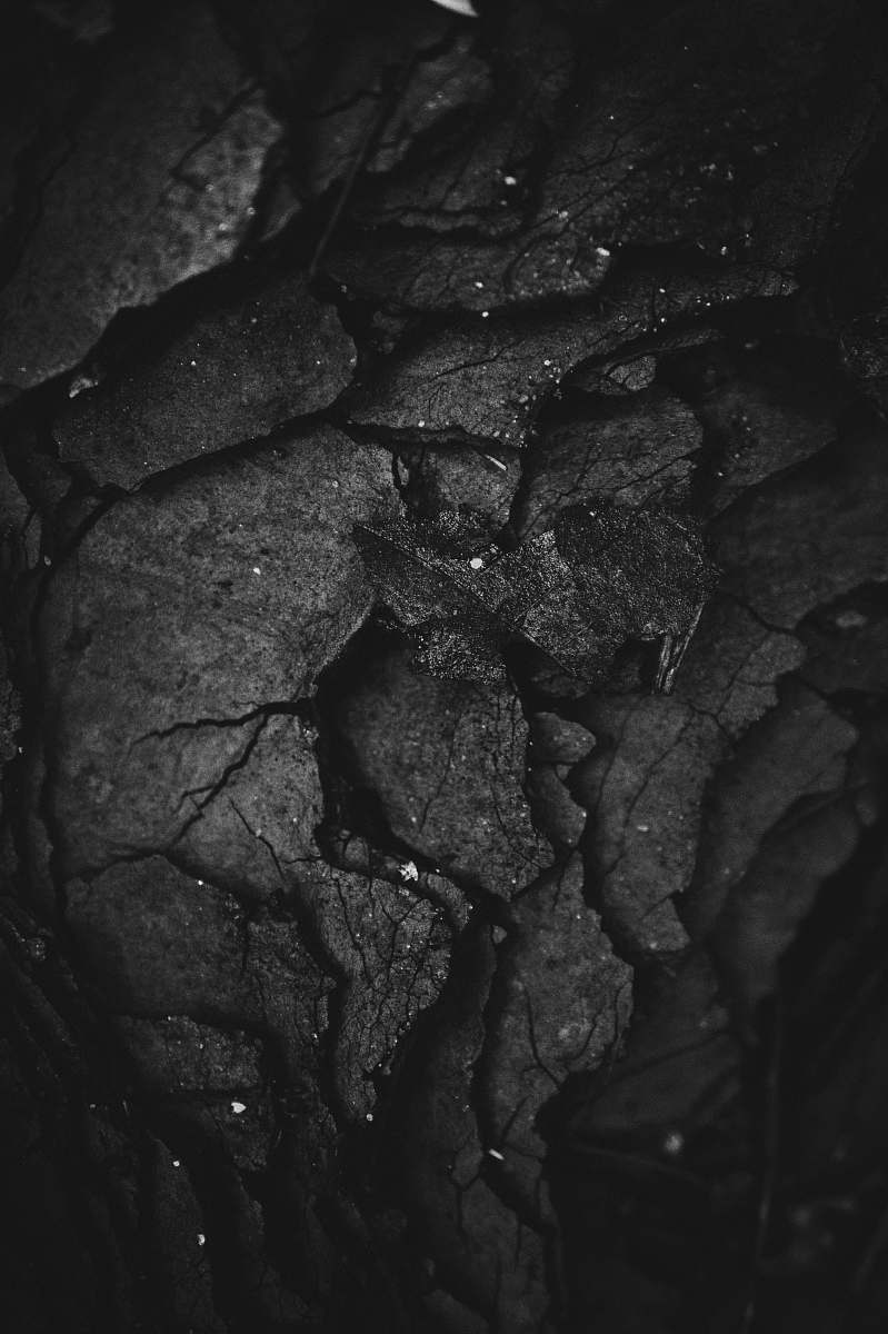 texture grayscale photography of rock formation black