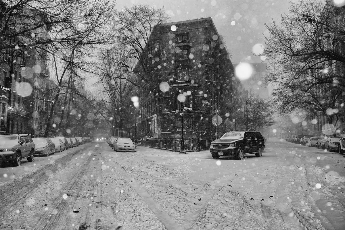 snow grayscale photography of street during witner east village