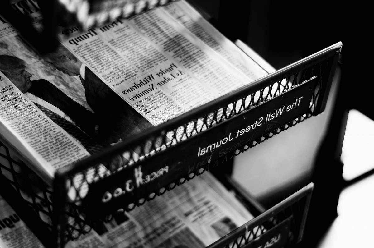 newspaper newspapers on The Wall Street Journal rack text