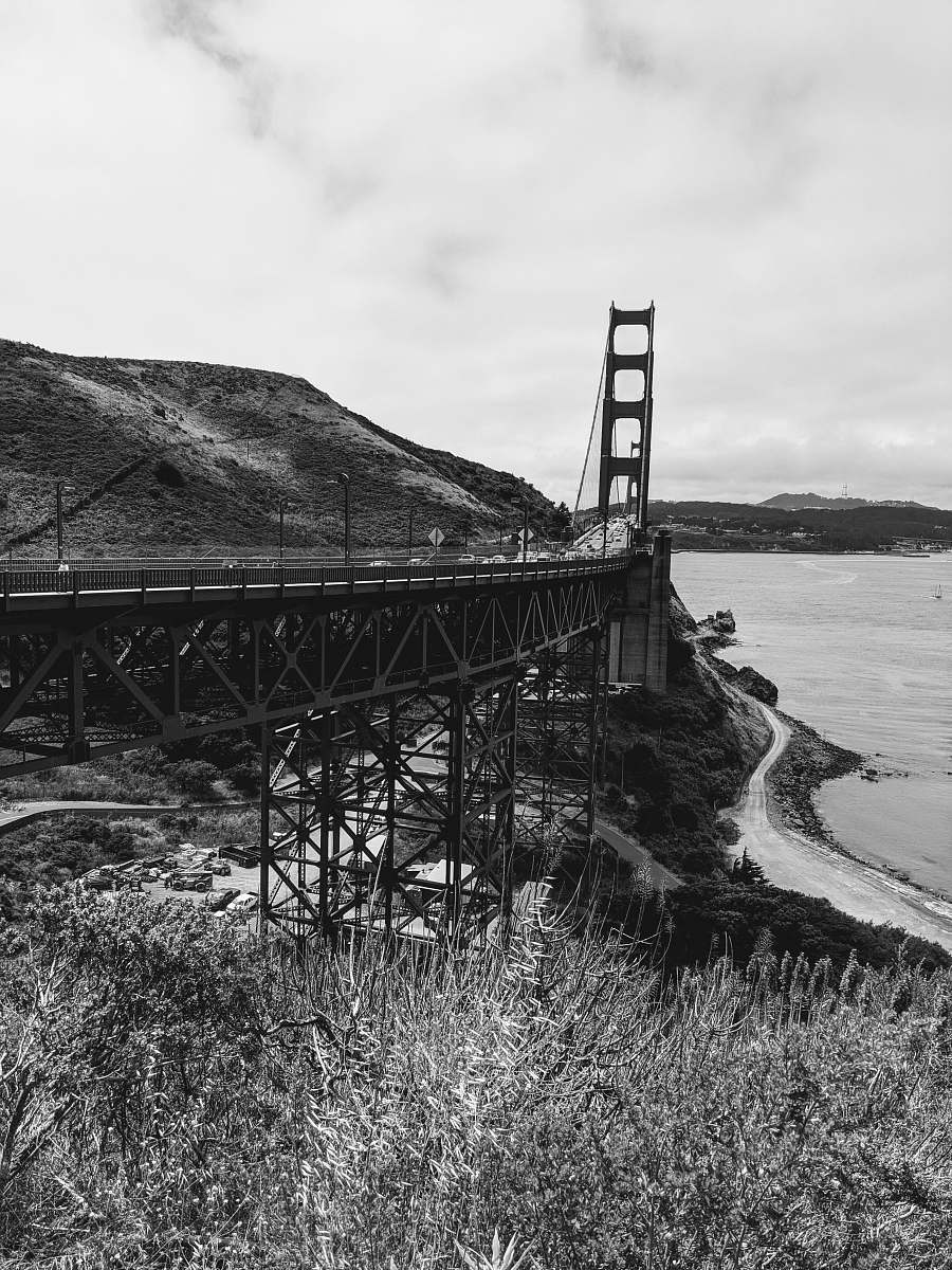building road leading to Golden Gate Bridge near shore bridge