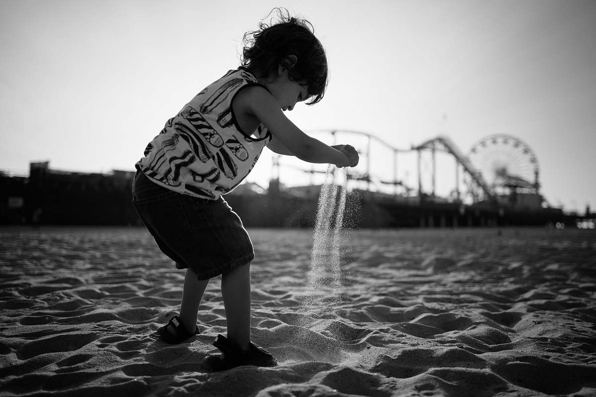 human toddler playing beach sand people