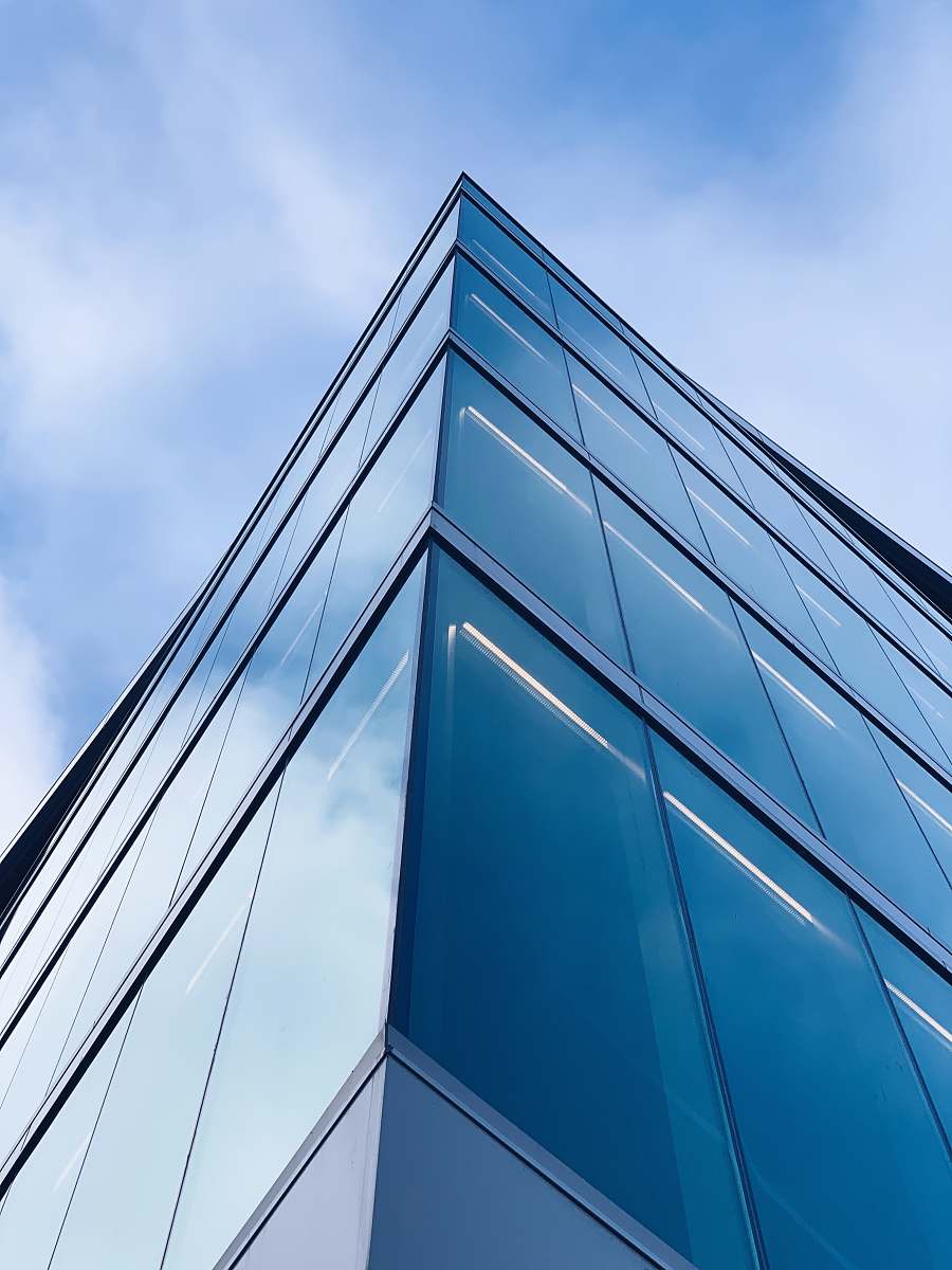 building low angle photography of glass building office building