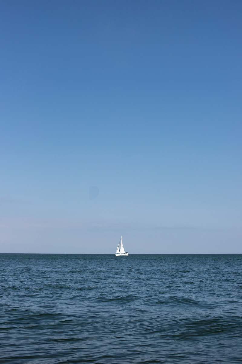transportation sailboat on sea under clear blue sky vehicle