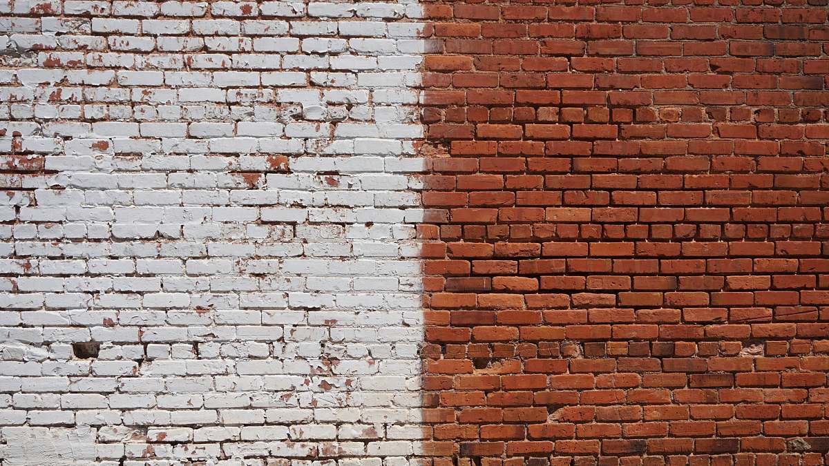 background photo of white and brown bricked wall during daytime wall