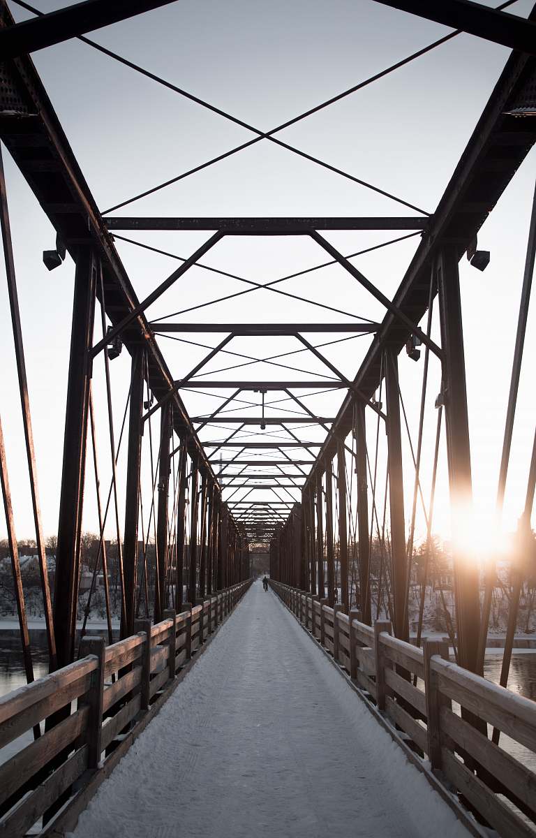 path gray and brown dock bridge during day time building