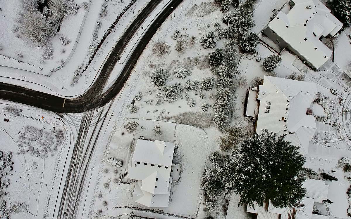 house aerial photography of houses coated with snow happy valley