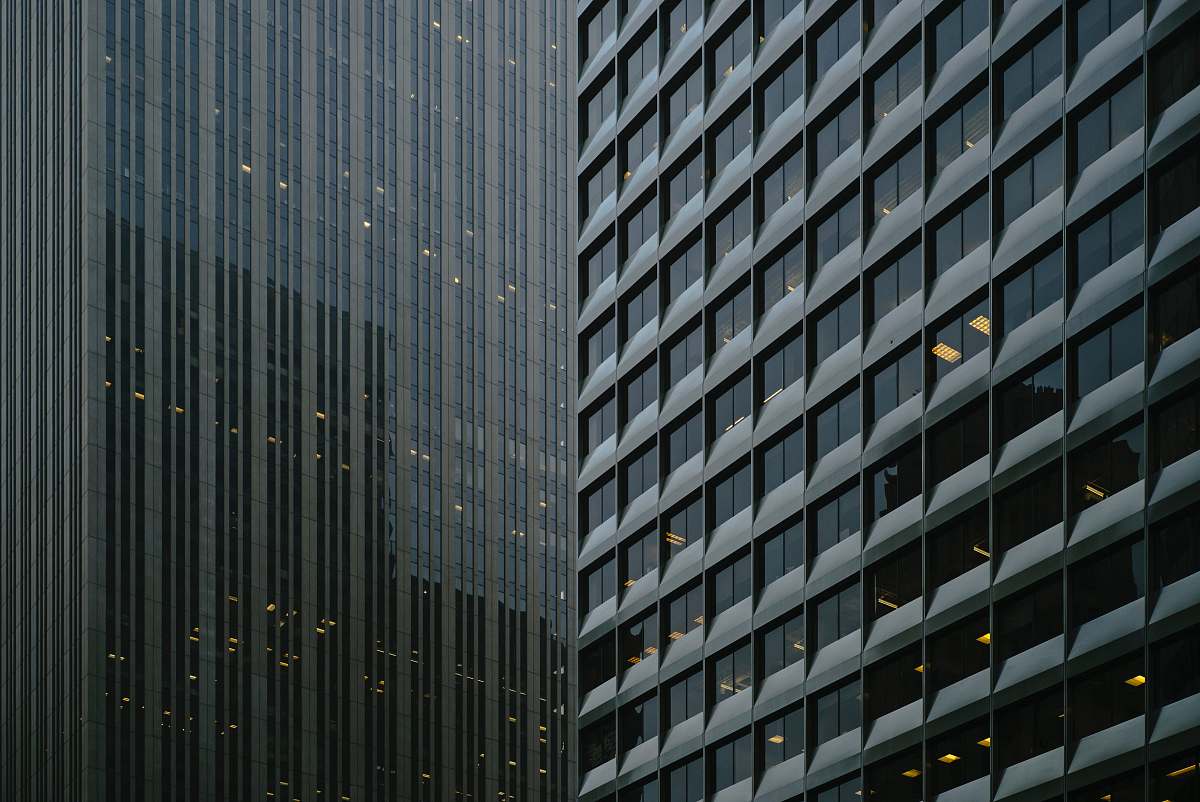 grey architectural photography of glass curtain buildings architecture