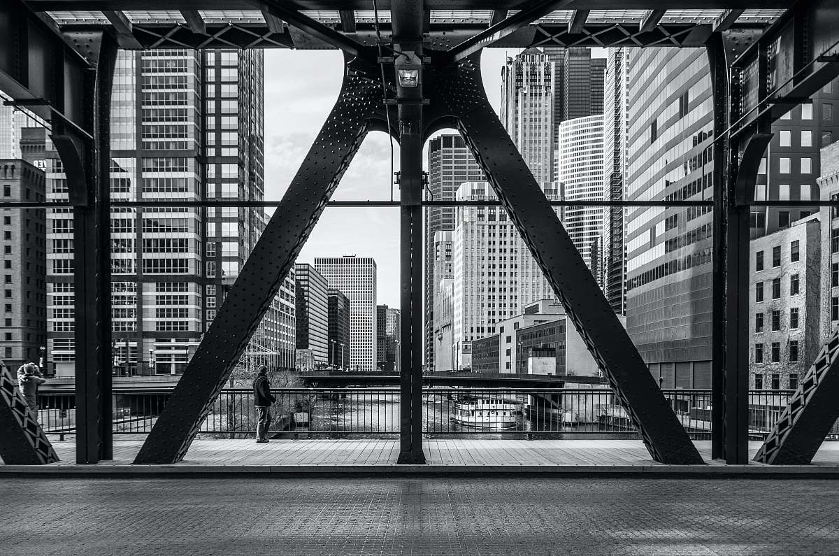 black-and-white architectural photography of metal buildings bridge