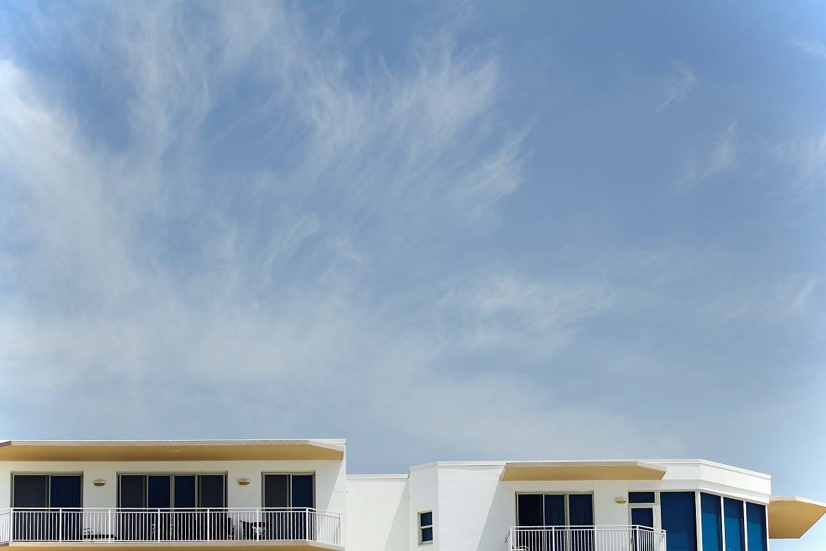 countryside architectural photography of white painted house hut