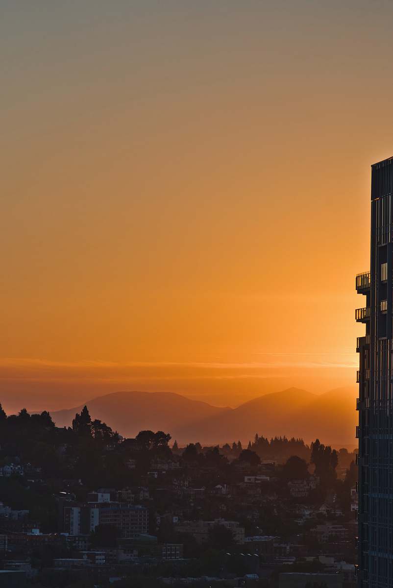 architecture city building across mountain during sunset tower