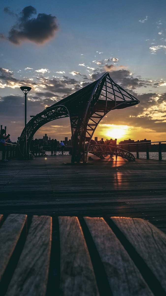 water gray building during golden hour bridge